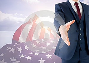 Business man shaking his hand against american flag