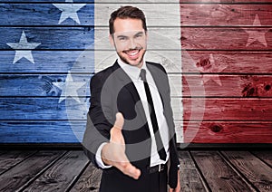 Business man shaking his hand against american flag