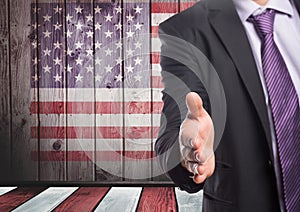 Business man shaking his hand against american flag