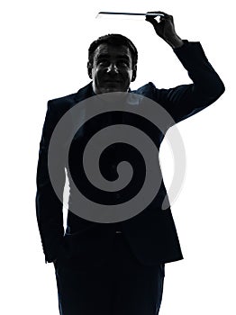Business man shielding digital tablet silhouette photo