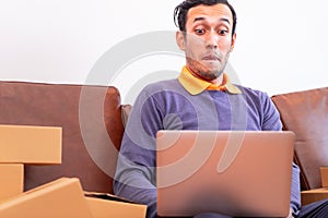 Business man shocking looking at Laptop computer