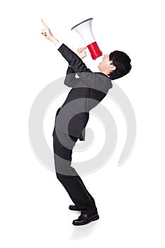 Business man shouting into a megaphone