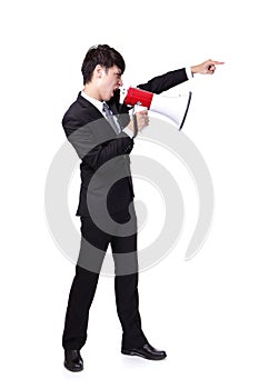 Business man shouting into a megaphone