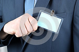 business man showing a Blank Badge