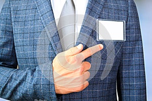 The business man showing a Blank Badge