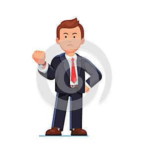 Business man showing gesture with clenched fist