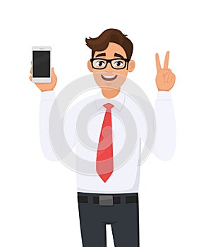 Business man showing new brand, latest smartphone. Man holding cell, mobile phone in hand and gesturing/making victory, V, peace.