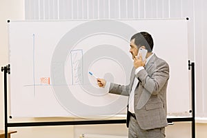 Business man showing presentation on a multimedia projector background. Technology concept. Copy space.