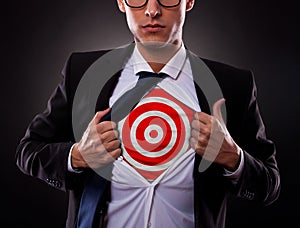 Business man showing a target under his shirt