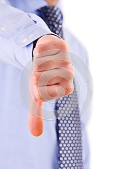 Business man showing thumbs down sign.