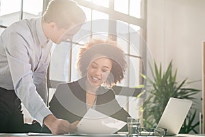 Business man showing to his colleague a document