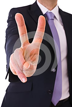 Business man showing Victory sign.