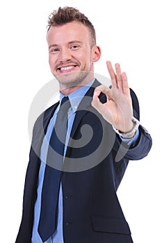 Business man shows ok gesture