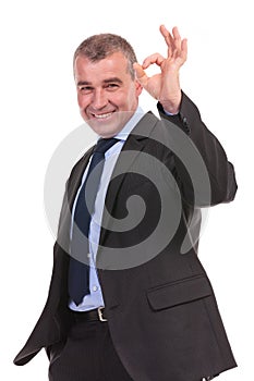 Business man shows the ok sign