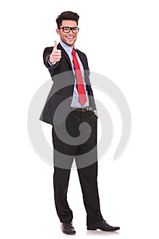 Business man shows thumbs up