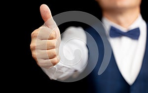Business man Shows thumbs up with his hand