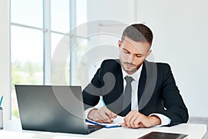 Business man signing contract and working on documents at modern office