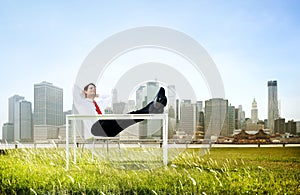 Business Man Sitting Back Relaxing Outdoors Concept