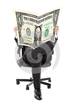 Business man sitting on a chair with American currency in hands