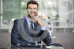 Business man sitting confident with smile portrait