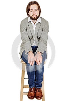business man sitting with depression loser posing. emotions, facial expressions, feelings, body language, signs. image on a white