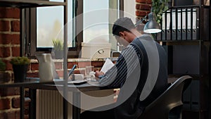 Business man sitting at desk and working on startup investment