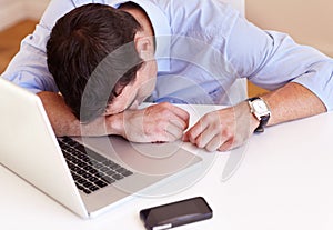 Business man, sleep and laptop at desk in office with fatigue, frustrated or tired for stress in workplace. Accountant