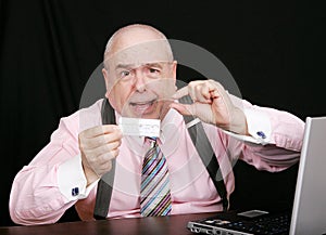 Business man with small paycheck photo
