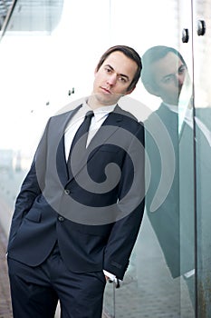 Business man standing alone outdoors