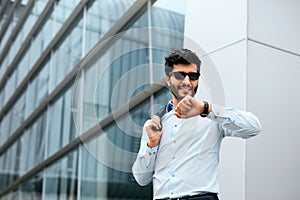 Business Man Standing Near Office Center