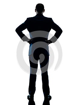 Business man standing rear view isolated