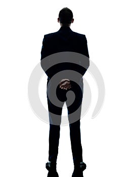 Business man standing rear view isolated