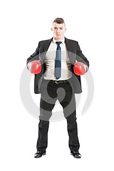 Business man standing with red boxing gloves