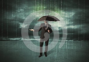 Business man standing with umbrella data protection concept