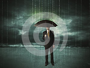 Business man standing with umbrella data protection concept