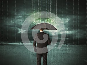 Business man standing with umbrella data protection concept