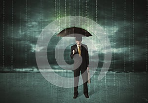 Business man standing with umbrella data protection concept