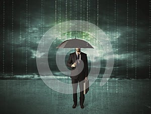 Business man standing with umbrella data protection concept