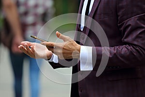 Business man in suit with mobile phone in hand