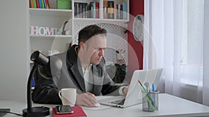 Business man in suit working at home office