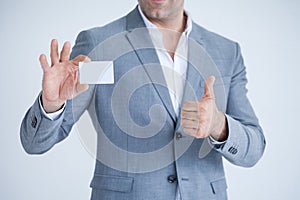 business man in Suits show thumb up and holding blank white credit card mockup isolated on white background with clipping path of