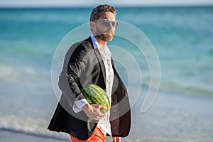 business man on summer vacation. businessman in wet suit at the beach. Summer business dreams. Successful businessman on