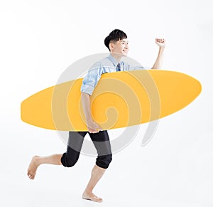 Business man with surfboard and summer vacation