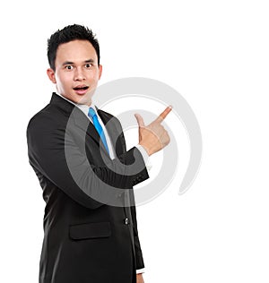 Business man surprisingly pointing at something