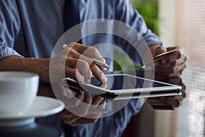 Business man using digital tablet computer and credit card for online shopping