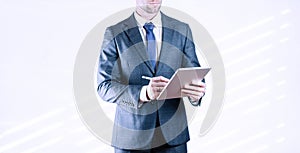 Business man tablet isolated. Business man analyzing economic growth graph chart and data sales on white. Digital