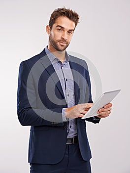 Business man with tablet in portrait, technology and communication for company isolated on studio background. Internet