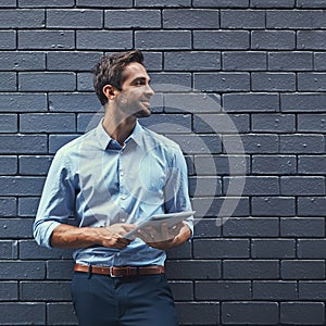 Business man, tablet and thinking of idea or research online on a wall background mockup space. Dream, digital tech and