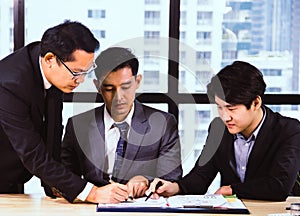 Business man teamwork meeting and discuss at desk in the office.