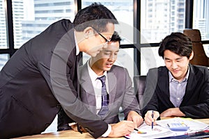 Business man teamwork meeting and discuss at desk in the office.